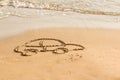 Draw car on beach sand. Conceptual design.Symbol car. concept of risk in real estate financing.drawing on the beach Royalty Free Stock Photo