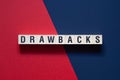 Drawbacks - word concept on cubes Royalty Free Stock Photo