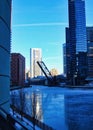 Drawbridge up over frozen Chicago river on a blue winter morning in Chicago