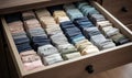 Drawer full of neatly folded socks in perfect order