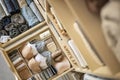 Drawer in the wardrobe with women's underwear, bras, briefs, socks and t-shirts. The concept of storage and order.