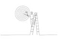 Drawing of ambitious businessman on ladder using paint roller to paint big dartboard, archery target. Single continuous line art Royalty Free Stock Photo