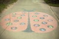 Drawing on asphalt. Ladybug painted on playground Royalty Free Stock Photo