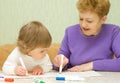 Drawing baby with her grandma Royalty Free Stock Photo