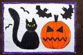 Drawing: Black cat, bad pumpkin and flying bats