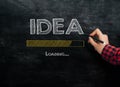 Drawing on a blackboard loading idea Royalty Free Stock Photo