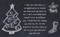 Drawing of christmas tree and handwritten greetings on black chalkboard