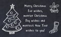 Drawing of christmas tree and handwritten greetings on black chalkboard