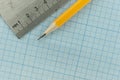 drawing compass, pencil, and ruler on graph paper background Royalty Free Stock Photo