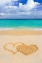 Drawing connected hearts on beach