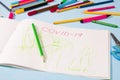 drawing coronavirus with green wax crayon in an album Royalty Free Stock Photo