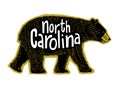 Drawing of cute Black Bear walking with North Carolina handwriting. Royalty Free Stock Photo