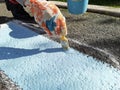 Drawing 3-D images on the asphalt in the park, on the children's playground.