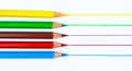 Drawing with five different colored pencil crayon on a white background Royalty Free Stock Photo