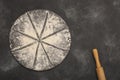 Drawing of flour in the form of a pizza and a rolling pin on a gray stone background. Free space for text . Top view Royalty Free Stock Photo