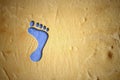 Drawing footprint blue sand Royalty Free Stock Photo