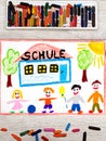 Drawing: German word SCHOOL, school building and happy children. Royalty Free Stock Photo