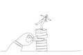 Drawing of giant hand pull back money from coin stack causing businessman to fall down. Metaphor for investment risk, liquidity,