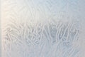 Drawing on glass in a frost . Frosty picture on the window. Frost pattern