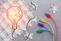 Drawing of glowing bulb on white puzzle paper cut with colorful Royalty Free Stock Photo