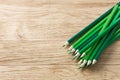 Drawing green pencils on a wooden background Royalty Free Stock Photo