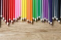 Drawing green pencils on a wooden background Royalty Free Stock Photo