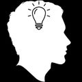 A drawing of a Man Head in white, with a Light bulb in it Royalty Free Stock Photo