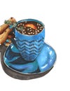 the drawing with markers is a blue cup of hot drink with pine nuts Royalty Free Stock Photo