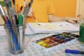 drawing materials on blurred background and the child is painting. creative activities and leisure for children Royalty Free Stock Photo