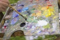 Drawing with oil paints on the nature. Wonderful hobby Royalty Free Stock Photo