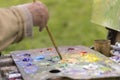 Drawing with oil paints on the nature. Wonderful hobby Royalty Free Stock Photo