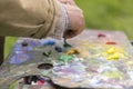 Drawing with oil paints on the nature. Wonderful hobby Royalty Free Stock Photo