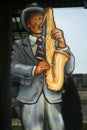 Display Art painting of a  Sax player in a window of a jazz joint in Laval Quebec Royalty Free Stock Photo