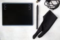 Drawing and painting tablet, glove and pen on the white background Royalty Free Stock Photo