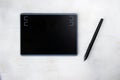 Drawing and painting tablet and pen on the white background Royalty Free Stock Photo