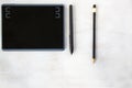 Drawing and painting tablet and styles pen and pencils on the white background Royalty Free Stock Photo