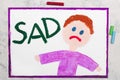 Drawing: Sad boy and word SAD Royalty Free Stock Photo