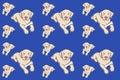 Drawing seamless pattern with cute lying dog and bone on blue background Royalty Free Stock Photo