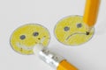 Drawing of smiley face with negative and positive expression with pencil and rubber - Negative emotion concept Royalty Free Stock Photo