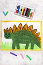 Drawing: Smiling dinosaur. Green weird stegosaurus