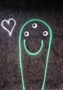 Drawing of a smiling ghost with green outline