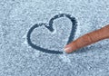 Drawing A Snow Heart Royalty Free Stock Photo