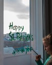 Drawing St. Patrick`s Day Child painting green three-leaved shamrocks indoor, home decoration, quarantine family leisure