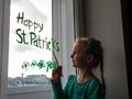 Drawing St. Patrick`s Day Child painting green three-leaved shamrocks indoor, home decoration, quarantine family leisure