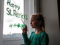 Drawing St. Patrick`s Day Child painting green three-leaved shamrocks indoor, home decoration, quarantine family leisure
