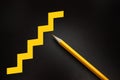 Drawing stairs, yellow pencil. Going up career concept. Growing business concept