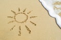 Drawing sun on beach - vacation concept background Royalty Free Stock Photo
