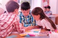 Children working on their school project together. Royalty Free Stock Photo