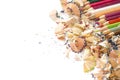 Drawing tools background. Lot of colorful pencils frame with sawdust and shavings on white Royalty Free Stock Photo