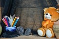 Drawing tools with bear doll and black mesh Royalty Free Stock Photo